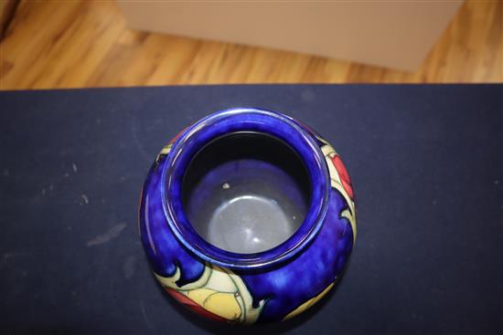 A Moorcroft blue ground Wisteria pattern vase height 22cm